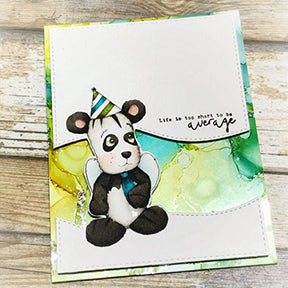 The foil makes all the difference in the world on this greeting card from heaven! The Yupo paper colored background is in greens and olives set apart from the topper of white with the Jazz digi stamp colored up as an adorable little gentlemen bear with his tie and party hat! The project for TLCDesigns.shop stamps