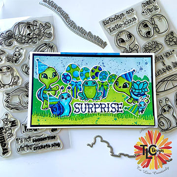 Turtld-icious stamp set available exclusively at tlcdesigns has been added to this delightful card project with a speckled background, grassy toll meadow and present/balloons everywhere for this celebration