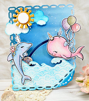 TLC designs paper crafting die called Aztec Sunshine Circle has adorable little embellishment dies to create a bright sun shiny day. This is a oceanic scene with the Fancy Fin Whale and dolphin used in coordination with the land and sea die too!