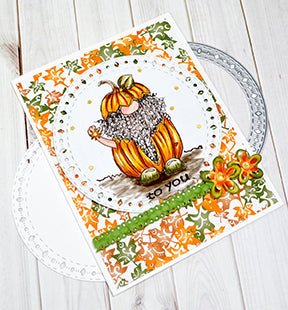 The Aztec Sunshine Circle paper crafting die from TLC Designs is the perfect offset die for any project in any season! This card is focused on Jack O' Gnome freebie digital image and the Celebrate Ribbon die from TLC Designs is used as well.