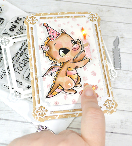 It's time to light the candle! This birthday interactive card is showing Happy the Dragon Polymer stamps from TLCDesigns.shop lighting a candle for real! On a greeting card! With the help of the EZ lite battery pack and LED light system