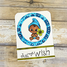The Aztec Sunshine die and the Celebrate Sentiment stamp from TLCDesigns.shop and the baby elf are just too cute on this greeting card project by TLCDesigns.shop