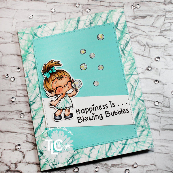 It's a windy day for bubble blowing at tlcdesigns.shop.  The Toa and Bubbles stamp is combined with Dragons in Winter designer paper