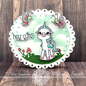 The perfect little oval card project in St Patricks day mint green backdrop colors. It's an adorable stamped image from the Alicorn Happiness stamp set at TLCDesigns.shop in the center of the card and the sentiment is hey Cutie! The project is grounded with the Land and Seas Die and is too too sweet!