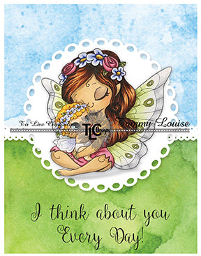 The blessings fairy stamp is colored with Copics and front and center on a greeting card full of blue skies and grassy tolls. It says I think about you Every Day! from TLCDesigns.shop