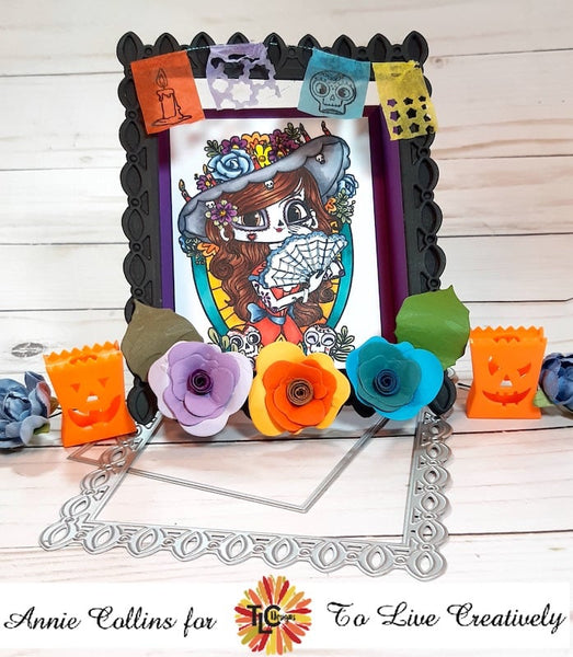 The day of the dead beauty of LaCatrina polymer stamp front and center on this frame look like ornamental die cut called the Rosie Sentiment die exclusively from TLC Designs.shop  The stunning blooms of the rose embellishment dies included in the set are front and center at the bottom of this project.  It's the perfect Day of the dead memorial project! 