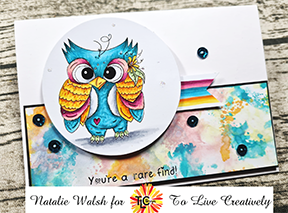Greeting card designer Natalie has brightfully copic colored Gazing Gabe the digital stamp illustration from TLcDesigns.shop.  Water colored spotting in the background including sequins